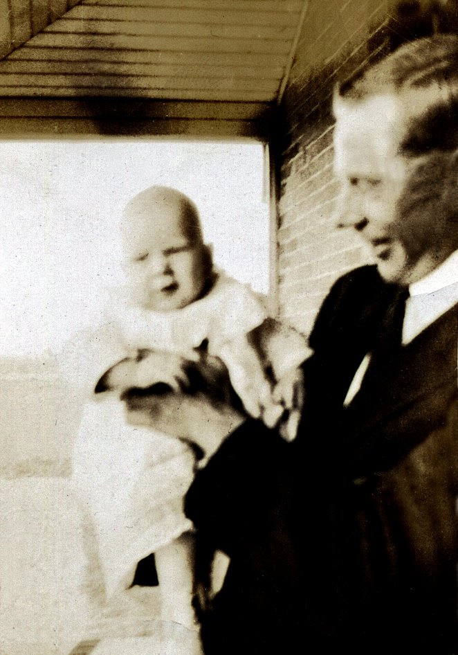 John_James_Weir_holding_son_Alexander_Cranston_circa_1920.jpg